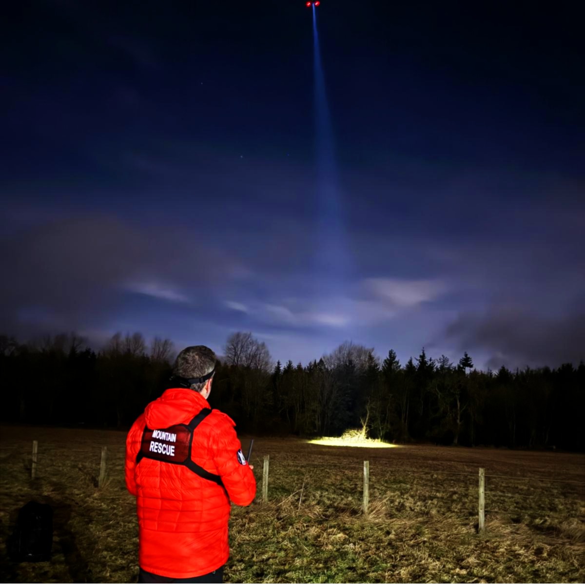 Night drone operations with light beam